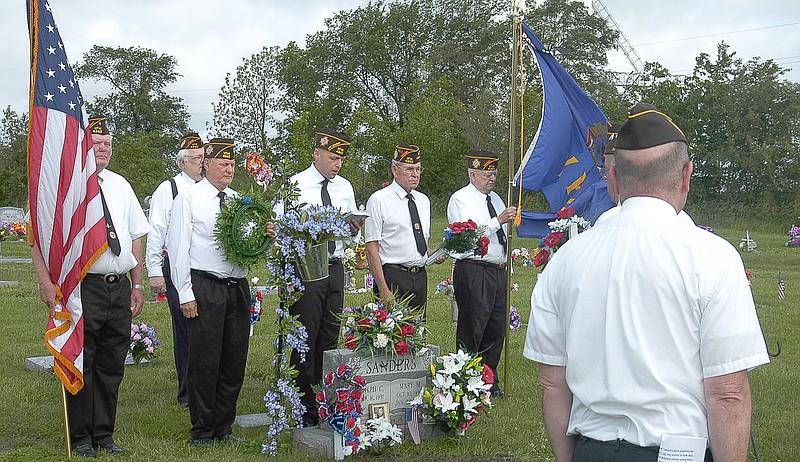Members of VFW Post 4345 stand at attention during the 2015 Memorial Day Service.