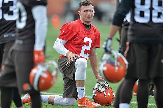 Browns quarterback Johnny Manziel takes a knee during organized team activity Tuesday in Berea, Ohio.