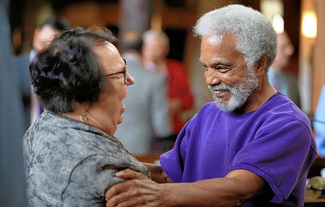 Nebraska state Sen. Ernie Chambers of Omaha, right, celebrates with Sen. Kathy Campbell of Lincoln after the unicameral legislature voted 30-19 to override Gov. Pete Ricketts, a Republican who supports the death penalty. The vote makes Nebraska the first traditionally conservative state to eliminate the punishment since North Dakota in 1973. 