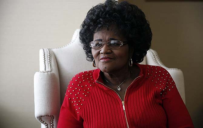 In this April 29, 2015 file photo, Zella Jackson Price poses for a photo at her attorney's office in Clayton, Mo. Price claims that her baby was stolen at Homer G. Phillips Hospital in 1965 after she was told the infant died, but a letter obtained by The Associated Press cites records that say she abandoned but baby at a different St. Louis hospital. Price says the May 21 letter to her daughter from the juvenile division of family court in St. Louis is rife with inaccuracies. Her lawyer says the records could have been falsified as part of a cover-up.