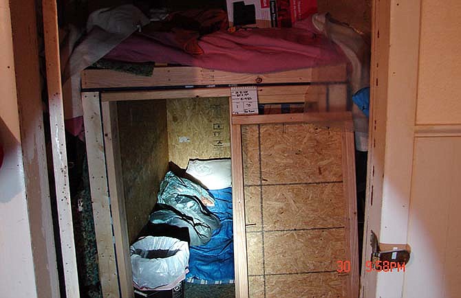 This photo provided May 28, 2015 by the Sedalia, Missouri, Police Department shows the crate where they say a Sedalia man held a woman captive before she escaped and was later shot to death. James Barton Horn was accused of holding Sandra Sutton captive off-and-on for months in Sedalia, Mo., before she escaped last month. Sutton and her 17-year-old son, Zachary Wade Sutton, were found shot to death last week at a relative's home in Clinton, where Sutton had gone to live after escaping Horn. 
