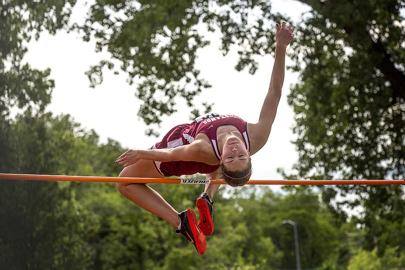 Eldon's Sara Rhine clears the bar Friday on her way to a state title in the high jump in the Class 3 state track and field championships at Dwight T. Reed Stadium.