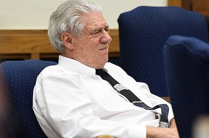 In this Wednesday, May 27, 2015 file photo, Wayne Burgarello listens as a witness takes the stand at the Washoe County District Court, in Reno, Nev. Jurors acquitted Burgarello of all charges on Friday, May 29, after a Nevada prosecutor urged them to convict him of first-degree murder, saying he was seeking out a deadly confrontation when he shot two unarmed trespassers in a vacant duplex he owns. Burgarello maintains he was acting in self-defense when he killed Cody Devine and seriously wounded Janai Wilson last year. 