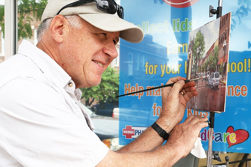 Marty Coulter of Washington, Missouri focuses on details as he nears the completion of his painting of Court Street in downtown Fulton. Coulter was one of 50 artists who participated in this year's "Callaway Plein Air " event, hosted by Art House.