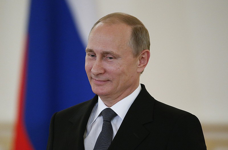 Russian President Vladimir Putin attends a ceremony in the Kremlin in Moscow, Russia.