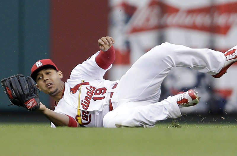Cardinals center fielder Jon Jay catches a ball hit by Jonathan Lucroy of the Brewers during the first inning of Monday night's game at Busch Stadium.