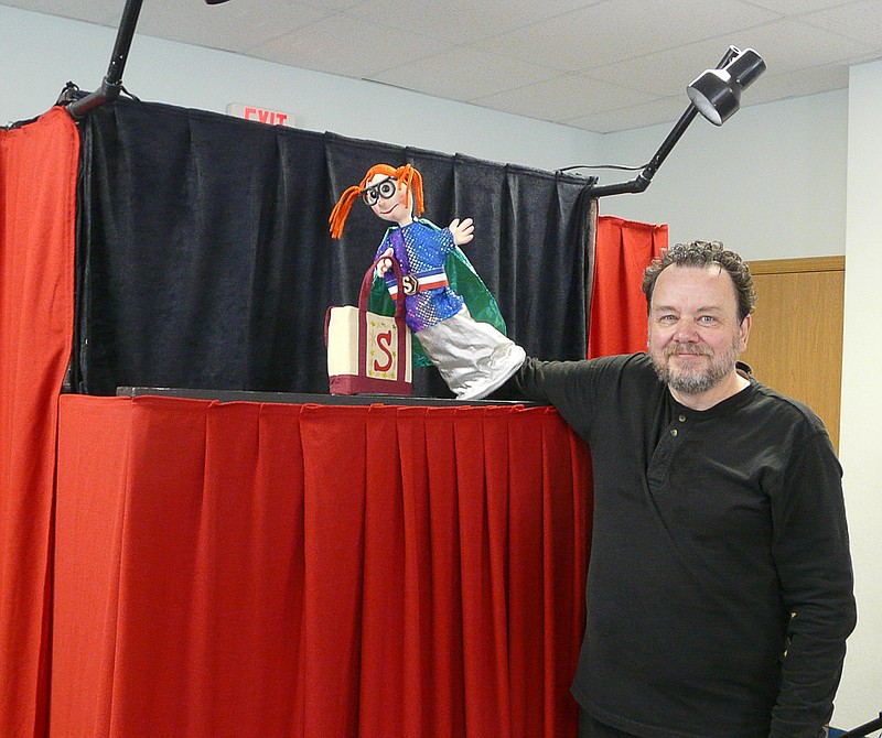 Puppeteer Peter Allen displays Super Susie after the puppet show at the Moniteau County Library.