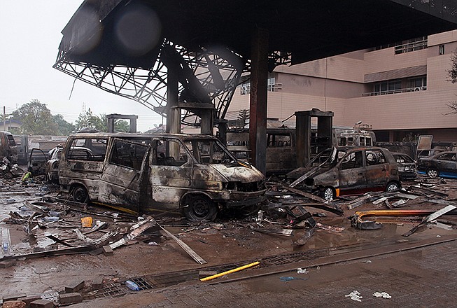 The remaining structure of a gas station seen Thursday after it exploded in Accra, Ghana. Flooding in Ghana's capital swept stored fuel into a nearby fire, setting off a huge explosion at a gas station that killed dozens of people and set alight neighboring buildings, authorities said Thursday.