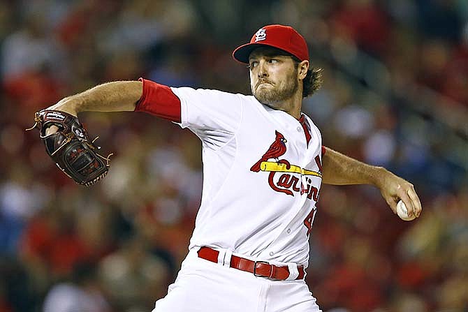 St. Louis Cardinals relief pitcher Kevin Siegrist throws during the eighth inning of a baseball game against the Los Angeles Dodgers, Friday, May 29, 2015, in St. Louis. The Cardinals won the game 3-0.