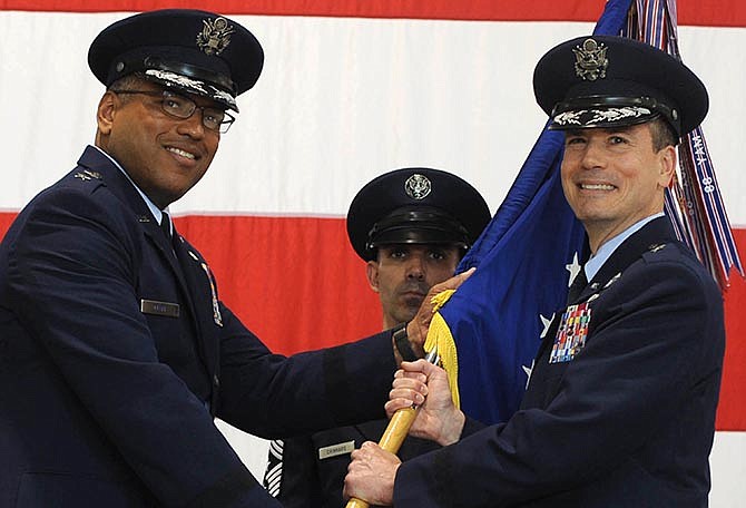In this photo provided by the U.S. Air Force, Brig. Gen. Paul W. Tibbets IV, right, receives the the 509th Bomb Wing guidon from Air Force Maj. Gen. Richard Clark, left, to take over leadership of the United States' aging fleet of nuclear-capable B-2 stealth bombers June 5, 2015 at Whiteman Air Force Base, Mo. Tibbets, a grandson and namesake of the man who piloted the B-29 that dropped the atomic bomb on Hiroshima, replaces Brig. Gen. Glen VanHerck, who has led the wing since February 2014.