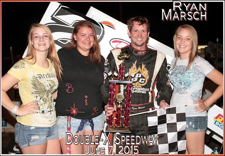 Ryan Marsch of Jefferson City claims his BW Graphics 600cc Winged Micro Sprint feature trophy from the California Sonic girls.