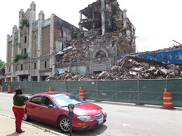 A wrecking crew tears down the deteriorating Murphy Building, June 2, in East St. Louis, Illinois after city officials declared the 106-year-old site a safety hazard. A new image-boosting campaign in St. Louis' Illinois suburbs barely mentions East St. Louis, a struggling city beset by violence, poverty and despair.