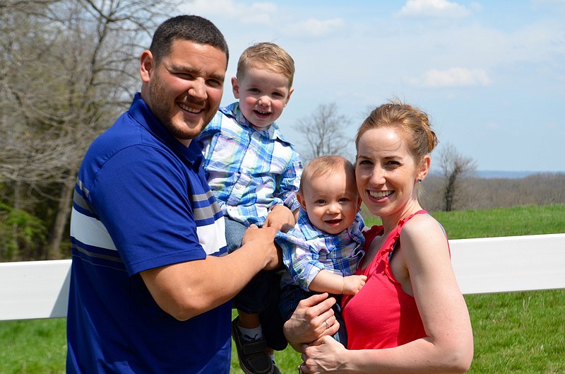 From left to right: Jon, Jon Jr., Franklin and Mollie pose for a family portrait.