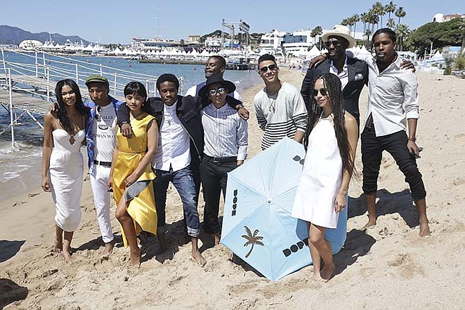 From left, Chanel Iman, Pharell Williams, Kiersey Clemons, Shameik Moore, Amin Joseph, Tony Revolori, Quincy Brown, Zoe Kravitz, Rick Famuyiwa and A$AP Rocky pose for photographers during a photo call for the film Dope, at the 68th international film festival, Cannes, southern France, Friday, May 22, 2015.