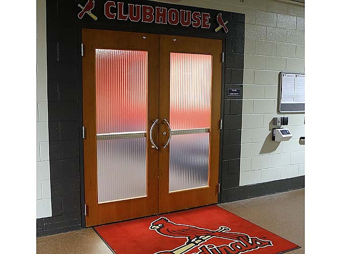 The doors of the St. Louis Cardinals clubhouse are closed before a scheduled baseball game against the Minnesota Twins, Tuesday, June 16, 2015, in St. Louis. 
