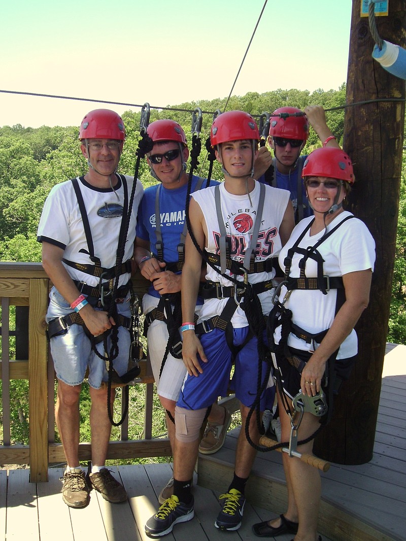 The Burger family enjoying zip lining in Branson during a recent vacation.