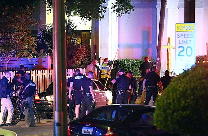 Police stand outside the Emanuel AME Church following a shooting Wednesday, June 17, 2015, in Charleston, S.C. 