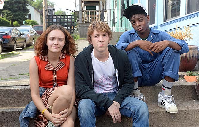 This photo provided by Fox Searchlight Pictures shows, Olivia Cooke, from left, as Rachel, Thomas Mann as Greg, and RJ Cyler as Earl, in a scene from the film, "Me and Earl and The Dying Girl." (Anne Marie Fox/Fox Searchlight Pictures via AP)