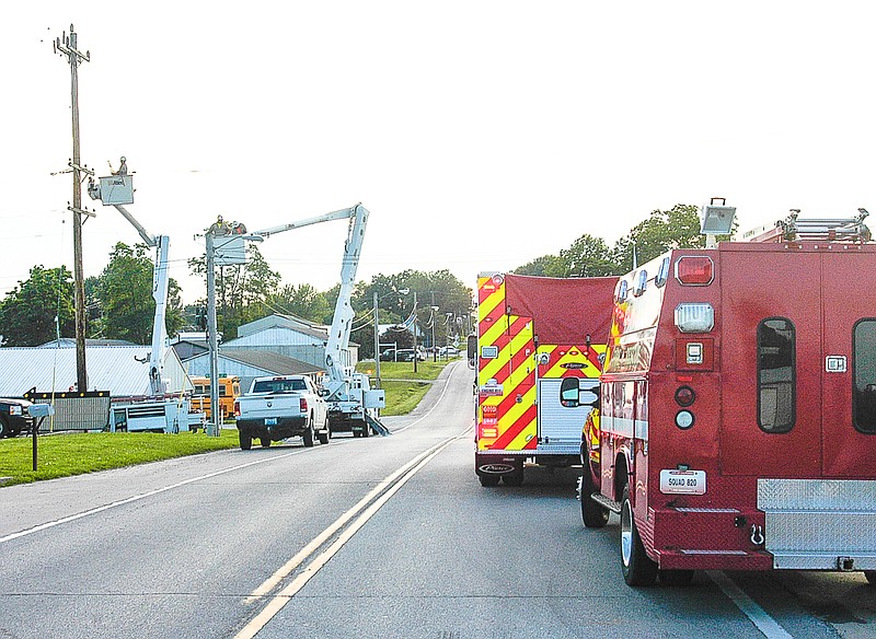 Democrat photo / David A. Wilson

The roadway is blocked with the assistance of the City Fire Department while a broken line is repaired by the City Utility Departments on Wednesday, June 10, in order to restore electric power to the southeast part of the City of California.