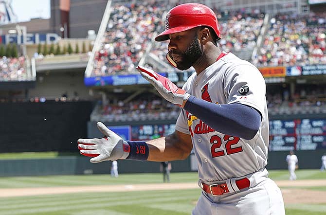 St. Louis Cardinals' Jason Heyward celebrates his solo home run off Minnesota Twins pitcher Mike Pelfrey in the seventh inning of a baseball game, Thursday, June 18, 2015, in Minneapolis.