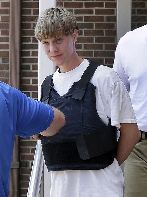 Charleston, South Carolina, shooting suspect Dylann Storm Roof is escorted from the Sheby Police Department  in Shelby, North Carolina, Thursday.
