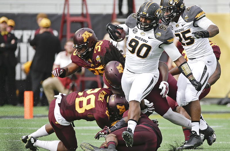 Missouri defensive lineman Harold Brantley runs for a first down on a fake punt during the first half of the Citrus Bowl against Minnesota earlier this year in Orlando, Fla.