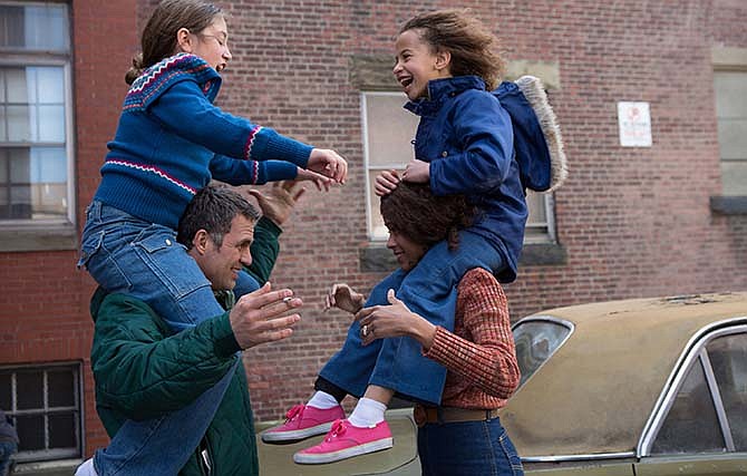 This photo provided by Sony Pictures Classics shows, from left, Imogene Wolodarsky as Amelia Stuart, Mark Ruffalo as Cam Stuart, Zoe Saldana as Maggie Stuart and Ashley Aufderheide as Faith Stuart, in a scene from the film, "Infinitely Polar Bear."