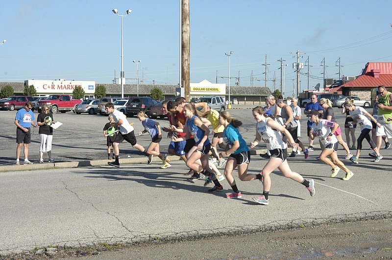 The runners come off the mark at the MCMC 5k Walk / Run which began at Village Green Shopping Center Saturday, June 20.