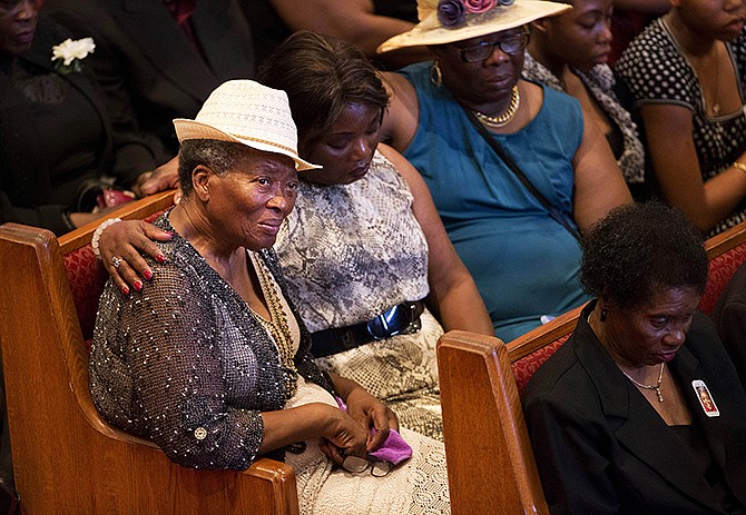 Mourners gather before the funeral service for Ethel Lance, one of the nine people killed in the shooting at Emanuel AME Church last week in Charleston, Thursday