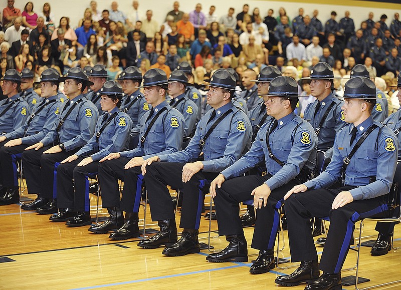 Cadets are seated while speakers bestow advice to them during Friday's 100th Recruit Class Commencement ceremony in Rackers Fieldhouse at Helias High School.