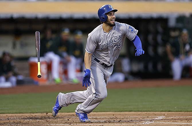 Kansas City Royals' Eric Hosmer flings his bat after hitting a two-run single off Oakland Athletics' Jesse Hahn in the third inning of a baseball game Friday, June 26, 2015, in Oakland, Calif. 