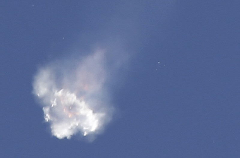 The SpaceX Falcon 9 rocket and Dragon spacecraft breaks apart shortly after liftoff at the Cape Canaveral Air Force Station in Cape Canaveral, Fla., Sunday. The rocket was carrying supplies to the International Space Station.