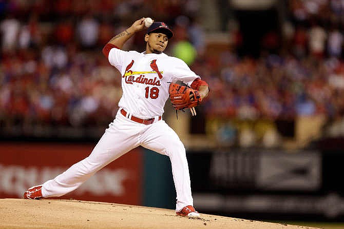 St. Louis Cardinals starting pitcher Carlos Martinez throws during the first inning of a baseball game against the Chicago Cubs Sunday, June 28, 2015, in St. Louis. 