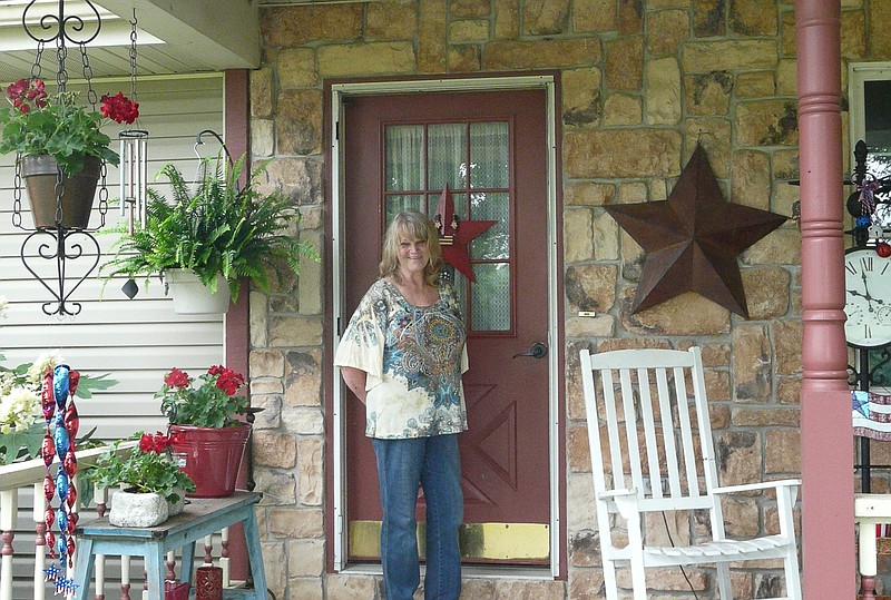 Cheryl Porter welcomes guests to her patriotic porch.