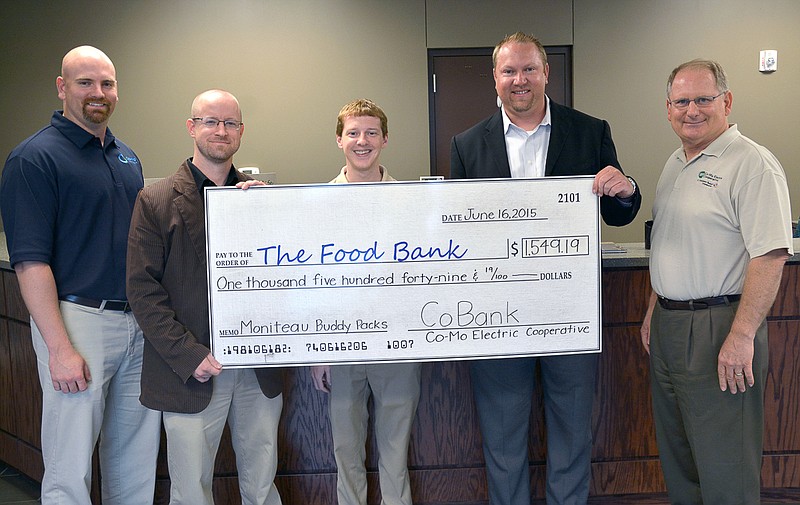 CoBank, one of Co-Mo Electric Cooperative's lenders, matched what employees and members of the co-op donated in food last year to the Food Bank for Central and North East Missouri's Buddy Pack program. Form left to right, Sean Friend, Co-Mo's Director of Finance; Travis Sappington, Southern Regional Coordinator with the Food Bank for Central & Northeast Missouri; Jordan Fischer, Co-Mo Electric Accountant; Seth Hart, Member Relations Manager at Cobank; and Ken Johnson, Co-Mo Electric CEO/General Manager.
