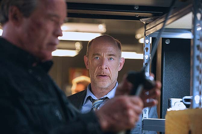 This photo provided by Paramount Pictures shows, Arnold Schwarzenegger, left, as the Terminator and J.K. Simmons as Detective O'Brien, in "Terminator Genisys," from Paramount Pictures and Skydance Productions. 