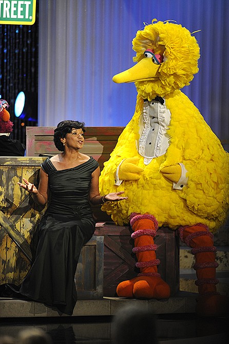 Actress Sonia Manzano performs with Big Bird in 2009 at the Daytime Emmy Awards in Los Angeles. Manzano, who has played the role of Maria on the groundbreaking kid show since 1971, is retiring. 
