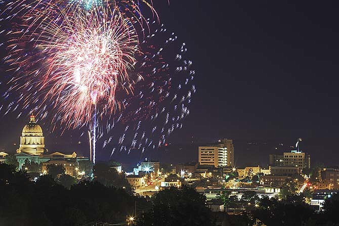 The fireworks show lights up the sky over downtown Jefferson City on Saturday evening, July 4, 2015, during the Salute to America celebration.