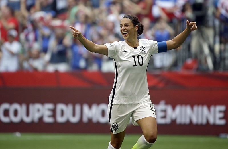 Carli Lloyd of the United States celebrates Sunday after scoring her third goal in the first half against Japan in the FIFA Women's World Cup title game in Vancouver, British Columbia.