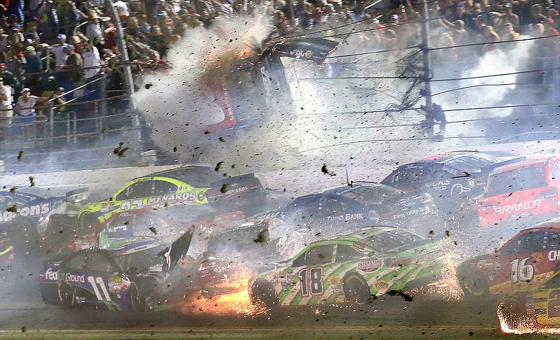 Austin Dillon goes airborne and hits the catch fence in a multi-car crash on the final lap of the Sprint Cup Series race Monday morning at Daytona International Speedway, in Daytona Beach, Fla. 