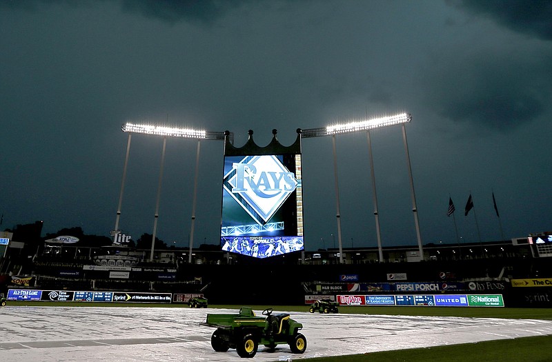 Dark clouds hang above Kauffman Stadium as a severe thunderstorm passes though Monday.