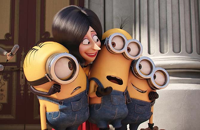 In this image released by Universal Pictures, Scarlet Overkill, voiced by Sandra Bullock, second left, appears with minions Stuart, left, Kevin and Bob, right, in a scene from the animated feature, "Minions."