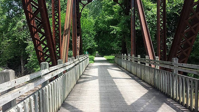 A bridge crosses Cedar Creek in Callaway County on the Katy Trail. The 240-mile trail passes through numerous towns, featuring various amenities from bed and breakfasts to shops and historic features from when the trail served as the MKT railroad line from Machens to Clinton.