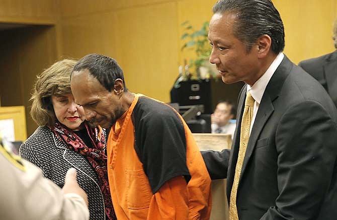 Francisco Sanchez, center, is lead out of the courtroom by San Francisco Public Defender Jeff Adachi, right, and Assistant District Attorney Diana Garciaor, left, after his arraignment at the Hall of Justice on Tuesday, July 7, 2015, in San Francisco. Prosecutors have charged the Mexican immigrant with murder in the waterfront shooting death of 32-year-old Kathryn Steinle.