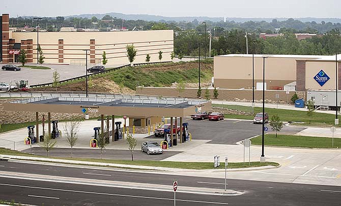 Customers fill up at the Sam's Club gas station in the parking lot of the Sam's Club store at 849 Stoneridge Parkway in Jefferson City. (July 2015 News Tribune photo)