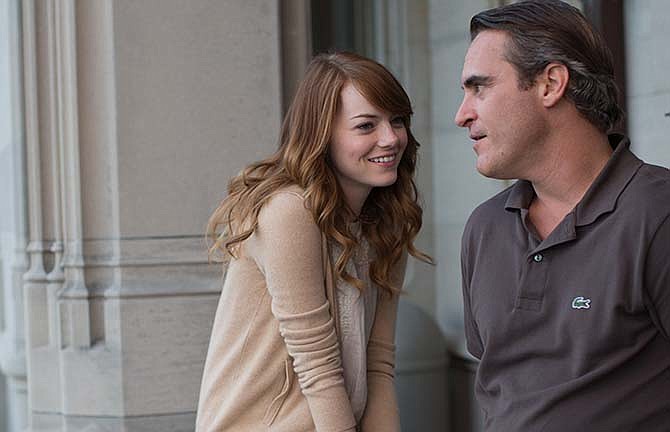 In this image released by Sony Pictures Classics Emma Stone, left, and Joaquin Phoenix appear in a scene from "Irrational Man."