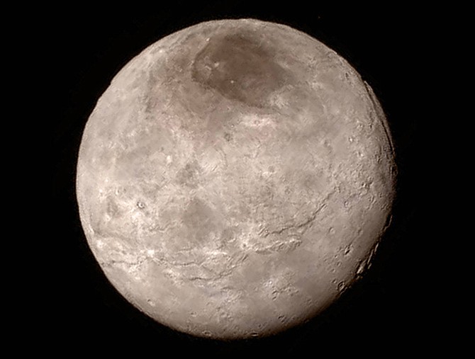 This Tuesday image provided by NASA on Wednesday shows Pluto's largest moon, Charon, made by the New Horizons spacecraft. 