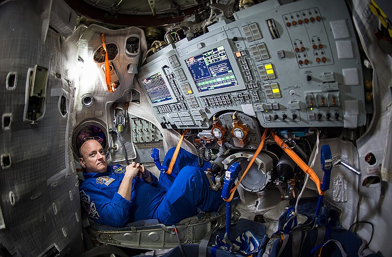 Astronaut Scott Kelly sits inside a Soyuz simulator in March at the Gagarin Cosmonaut Training Center (GCTC) in Star City, Russia. On Thursday, a piece of space junk forced the three International Space Station astronauts, including Kelly, to seek emergency shelter in their Soyuz spacecraft docked to the station, in case they had to make a quick getaway. 