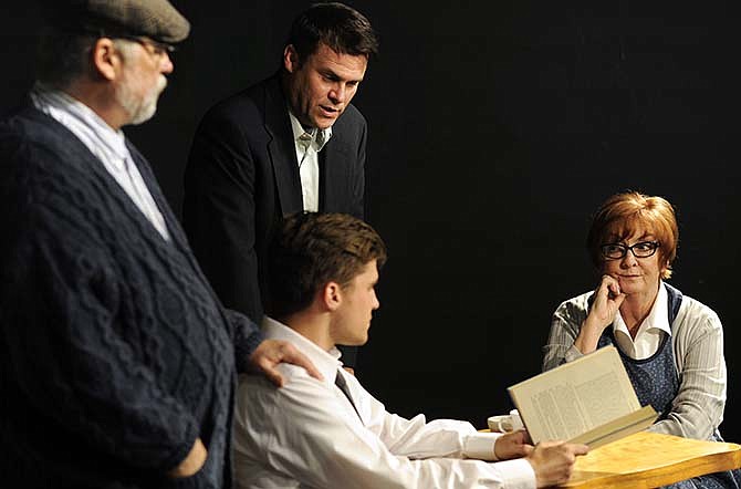 Charlie Tynan, played by Tom Baker (standing center) looks in on the ghosts of his past including his younger self (John Schulte, sitting center), and his deceased adoptive parents "Da" Nick Tynan (Allen Tatman) and Mother Maggie Tynan (Gretta Ratliff) during a rehearsal for Scene One Theatre's upcoming production of Irish playwright Hugh Leonard's comedy "Da."