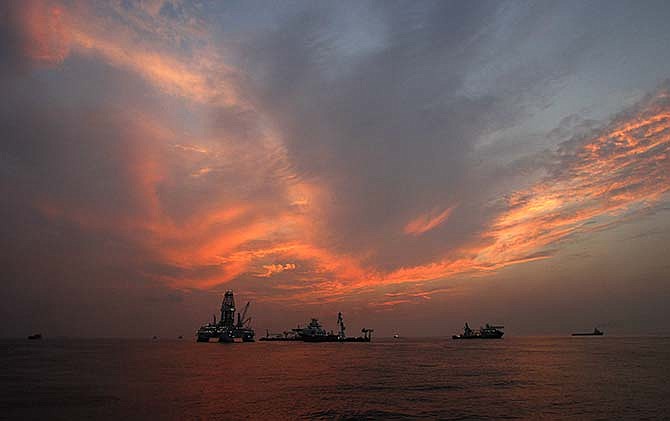 This Saturday, Sept. 4, 2010 file photo shows vessels assisting in the drilling of the Deepwater Horizon relief well on the Gulf of Mexico near the coast of Louisiana at sunset. The BP leak, the worst-ever in offshore U.S. waters, occurred at a well that the company was in the process of temporarily closing. The accident killed 11 workers and spilled up to 172 million gallons of oil. Federal officials defend their well safety efforts since then, and there have more permanent closures. There were 25,928 permanently sealed wells in mid-May 2015, up 10 percent from 23,468 at the end of the BP spill, according to the AP analysis of federal data. 